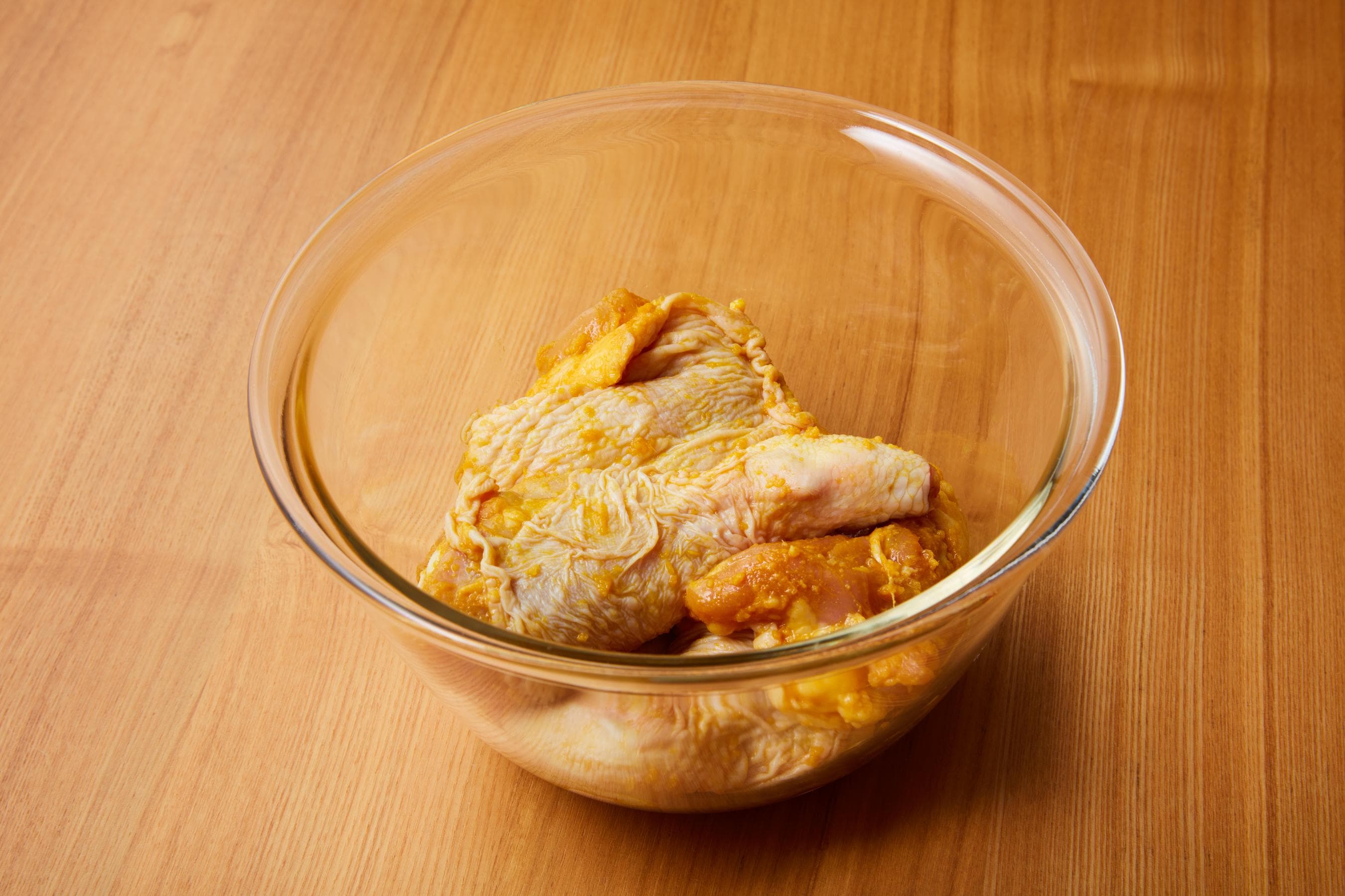 Marinating the chicken pieces with Kikkoman Soy Sauce