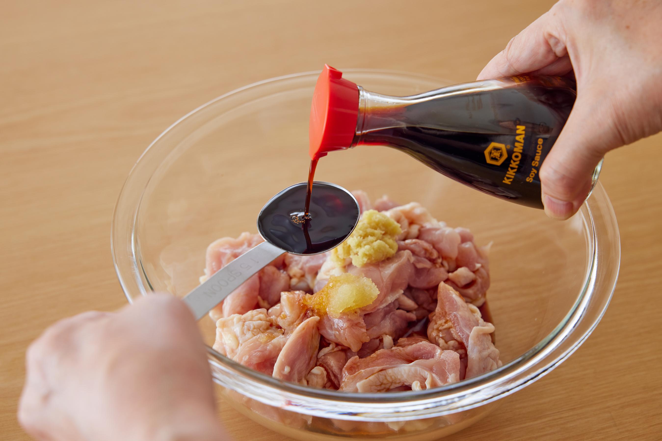 adding seasonings to the chicken