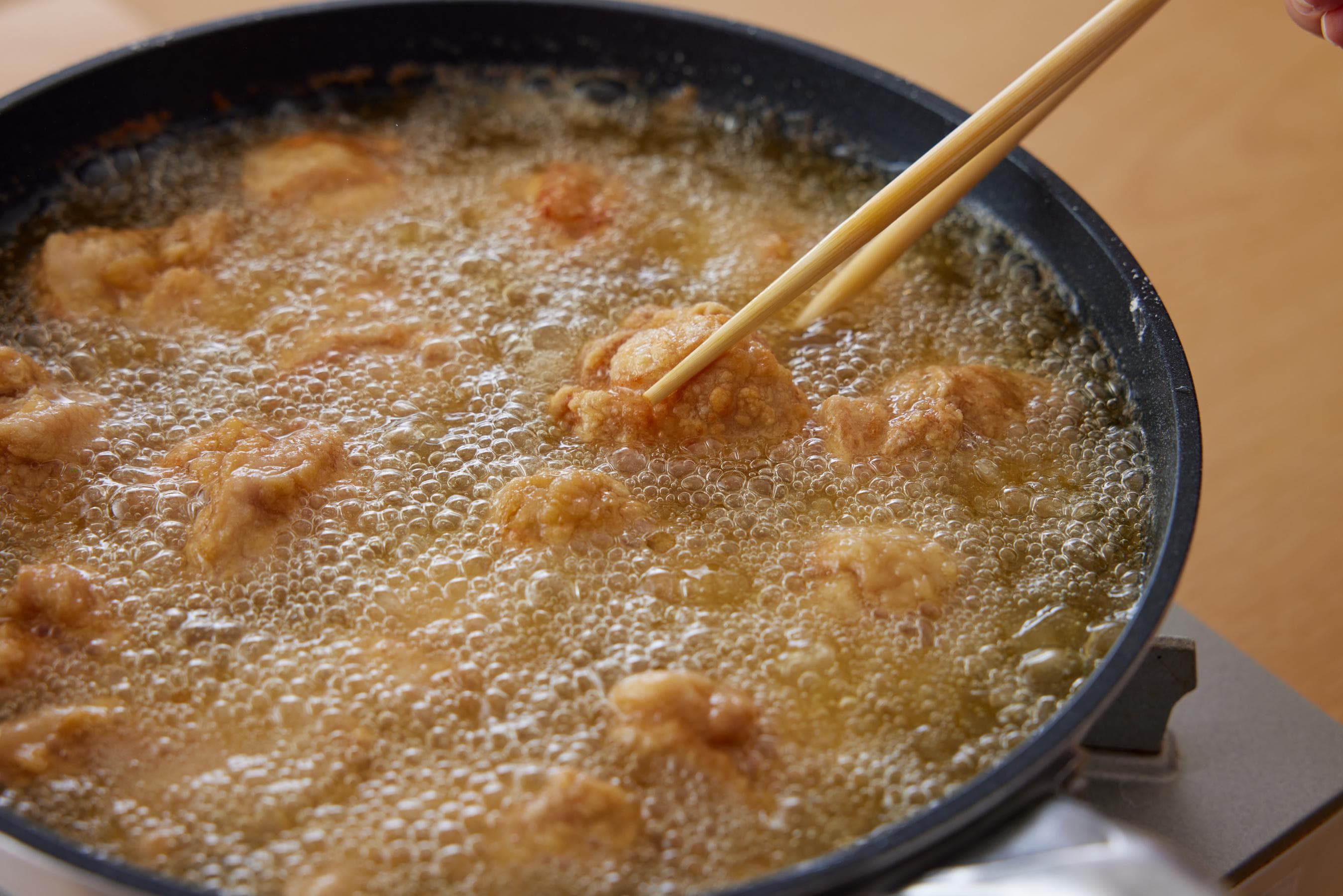 flipping over the pieces of chicken