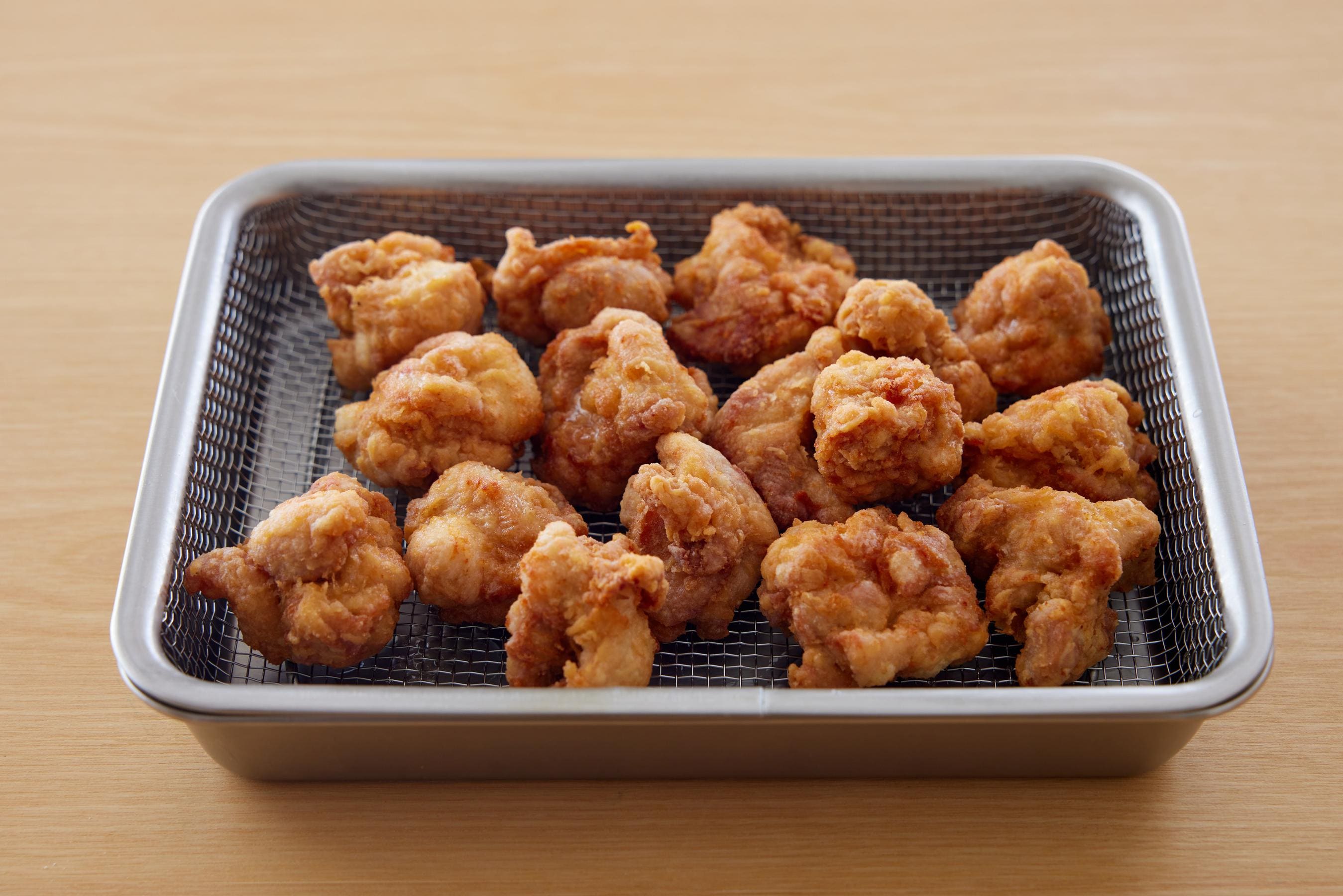 fried chicken on a cooking rack