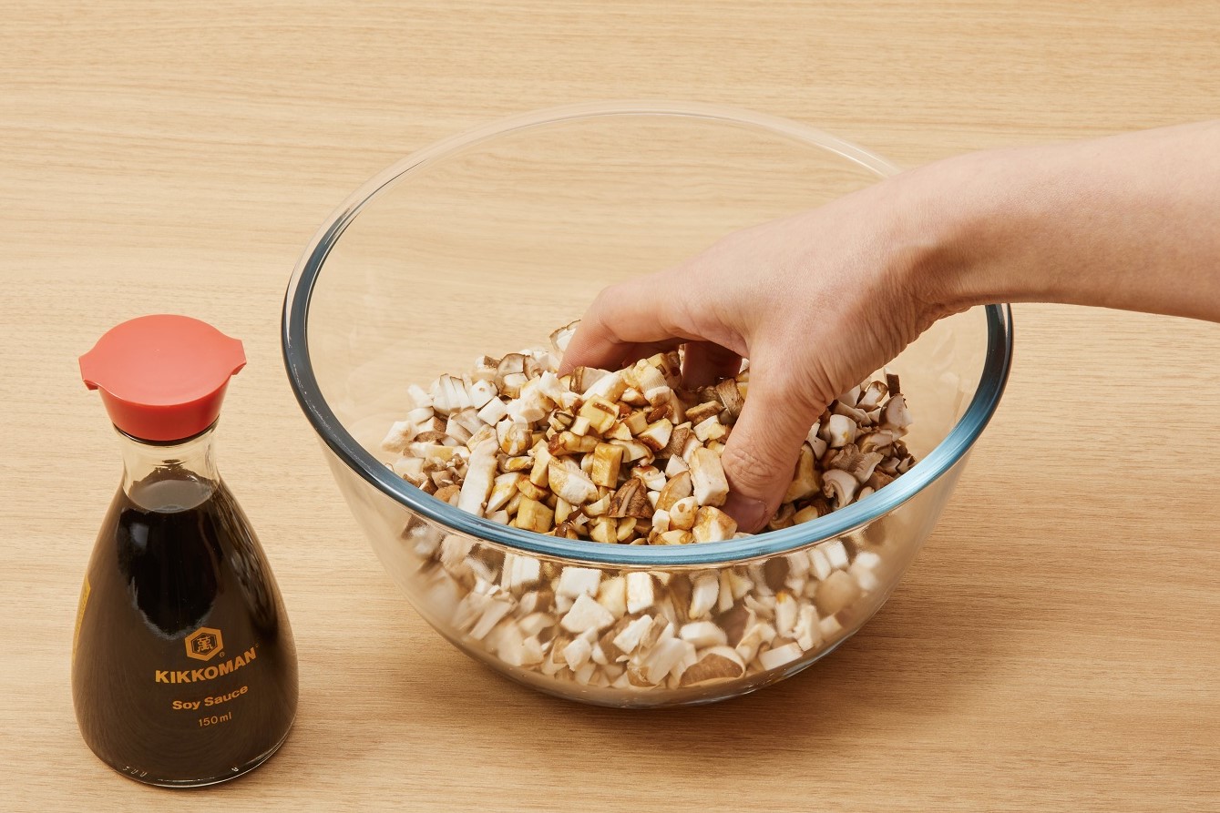 Massage the shiitake mushrooms in soy sauce