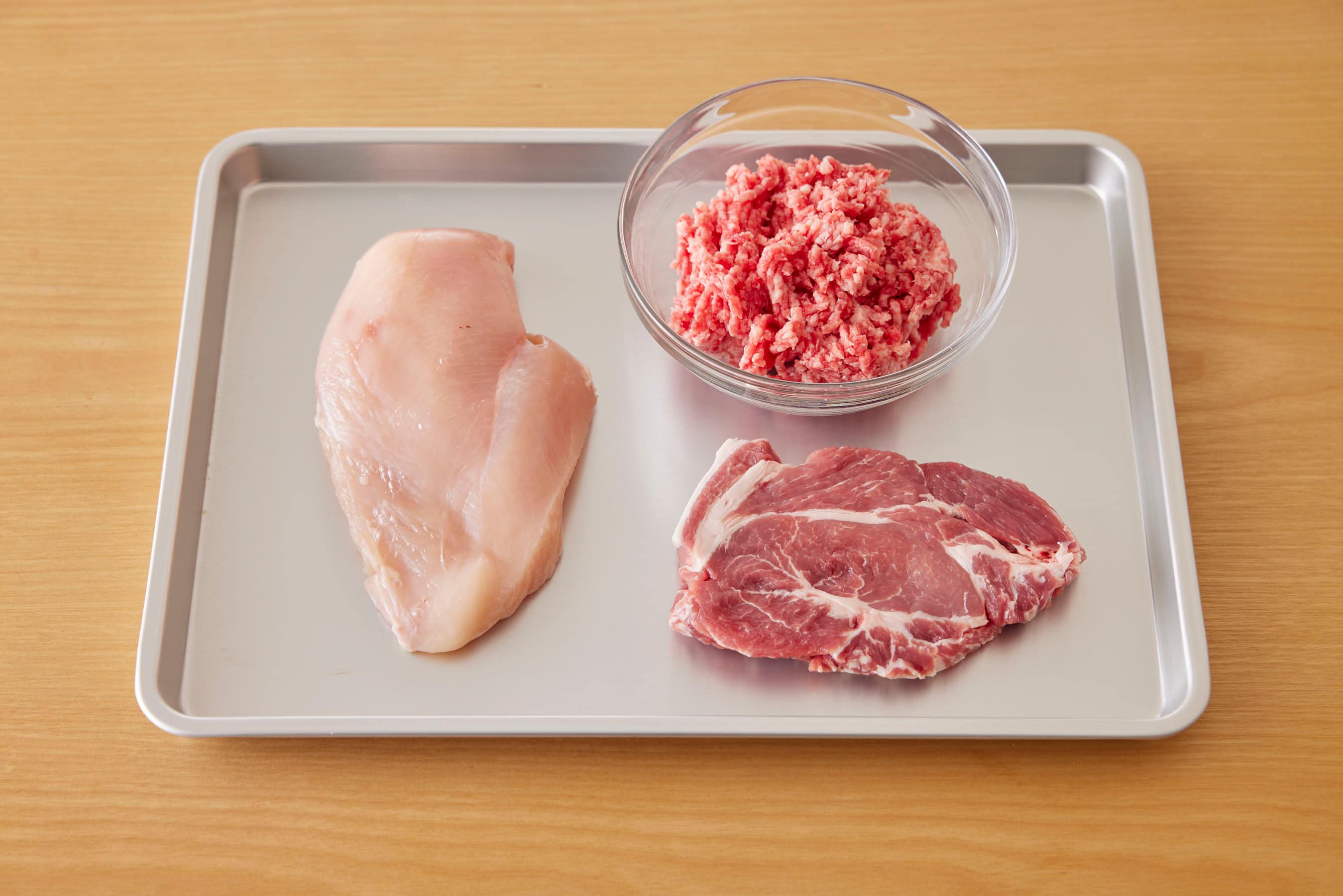 Chicken, pork and ground meat on a trey