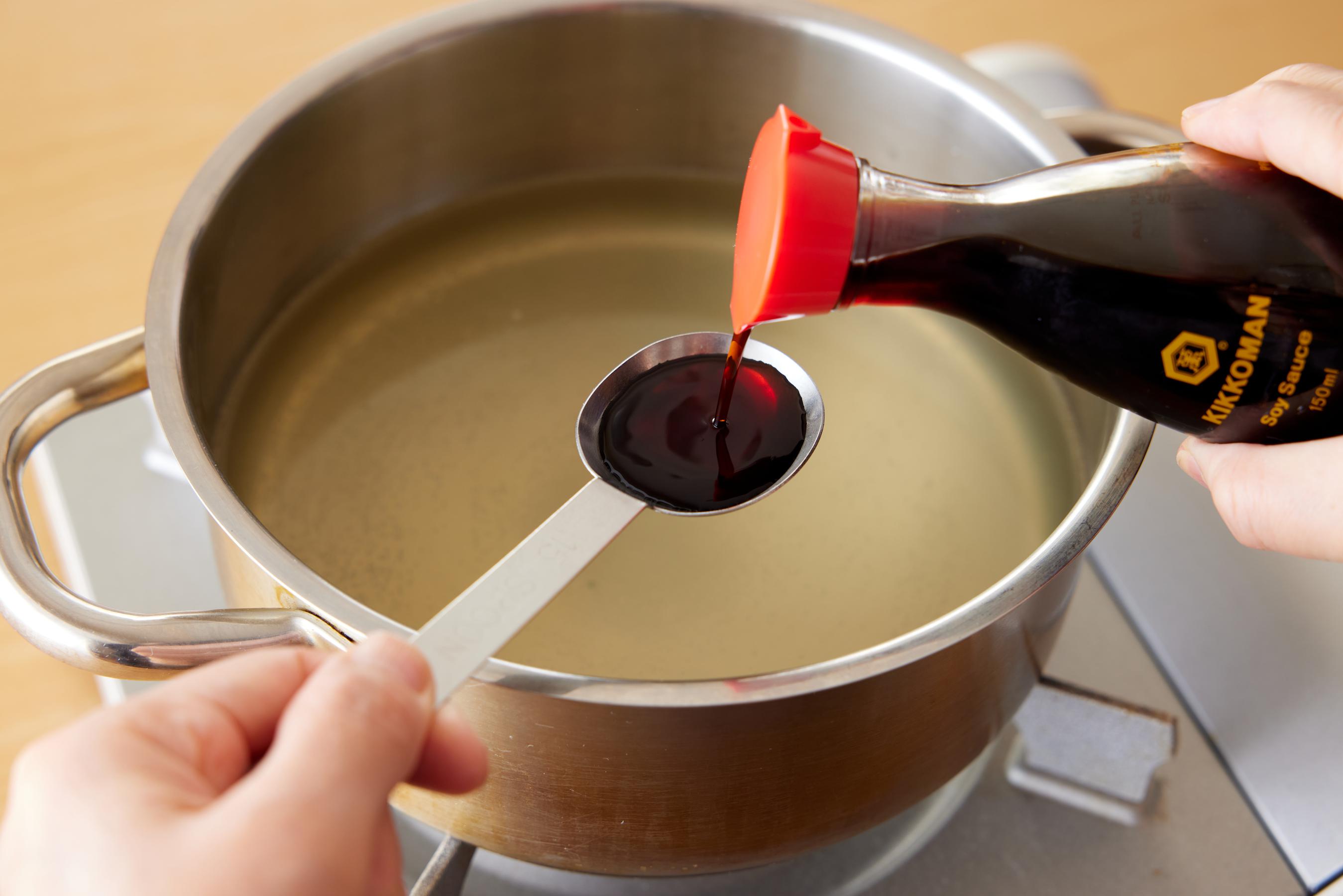 adding Kikkoman Soy Sauce