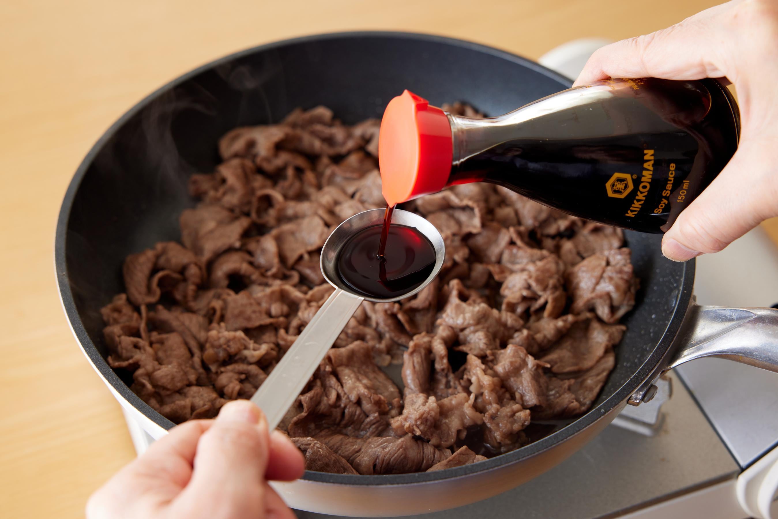 cooking beef in a fry pan