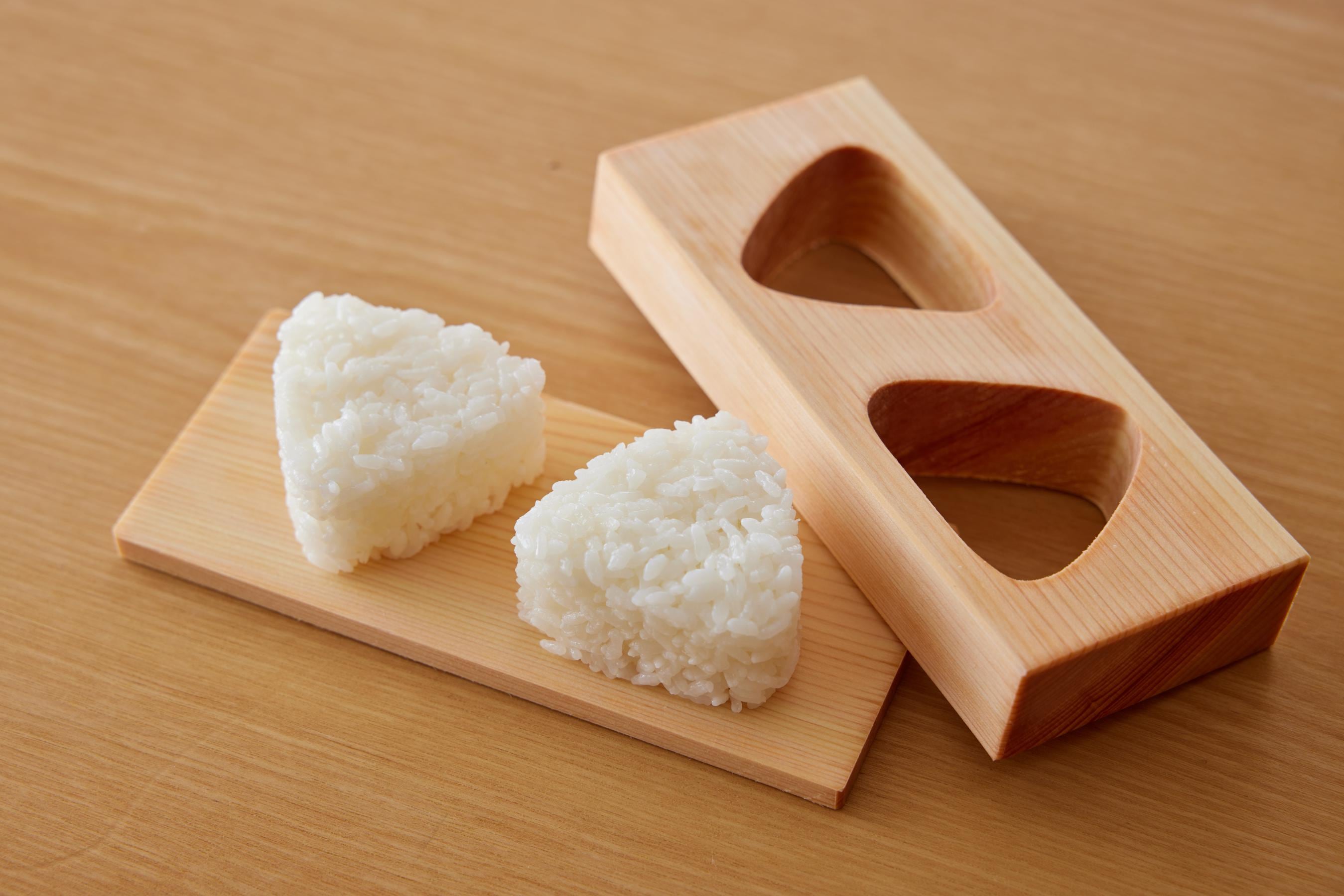 forming the rice into a triangular shape using Onigiri mould