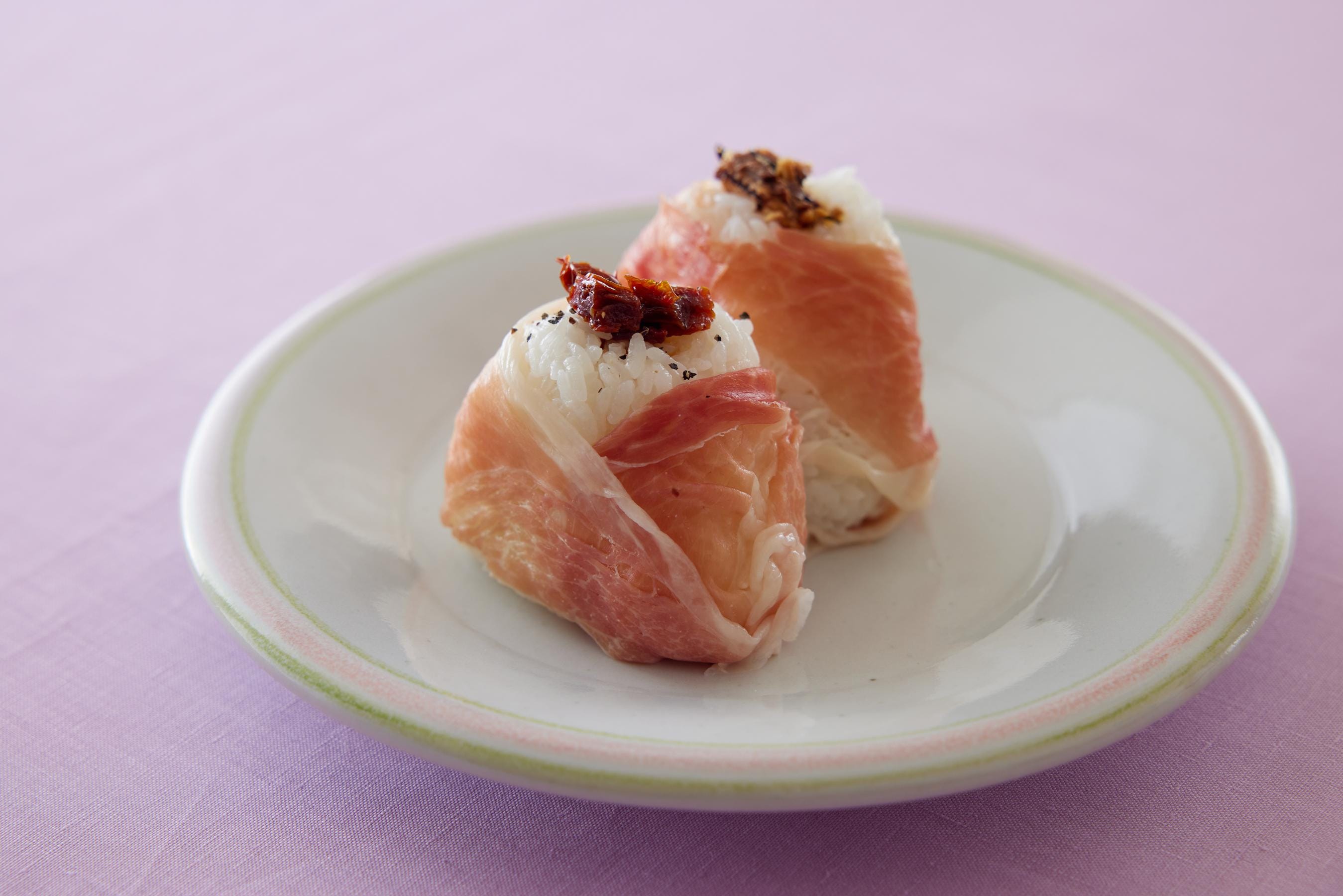 Dried Tomato and Sardine Onigiri (Rice Balls) on a plate