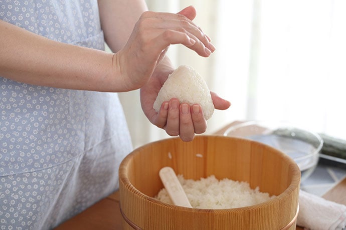 Making onigiri by hand