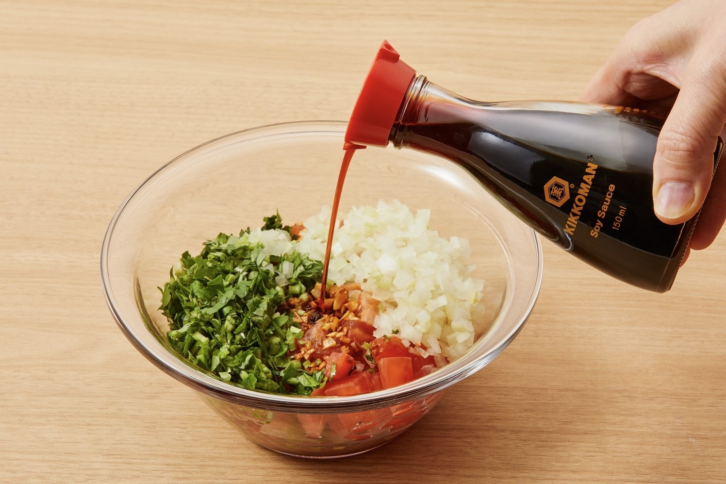 Mix the tomatoes, onions, garlic, cilantro, lemon juice, hot sauce, and soy sauce in a bowl for the fresh tomato sauce.