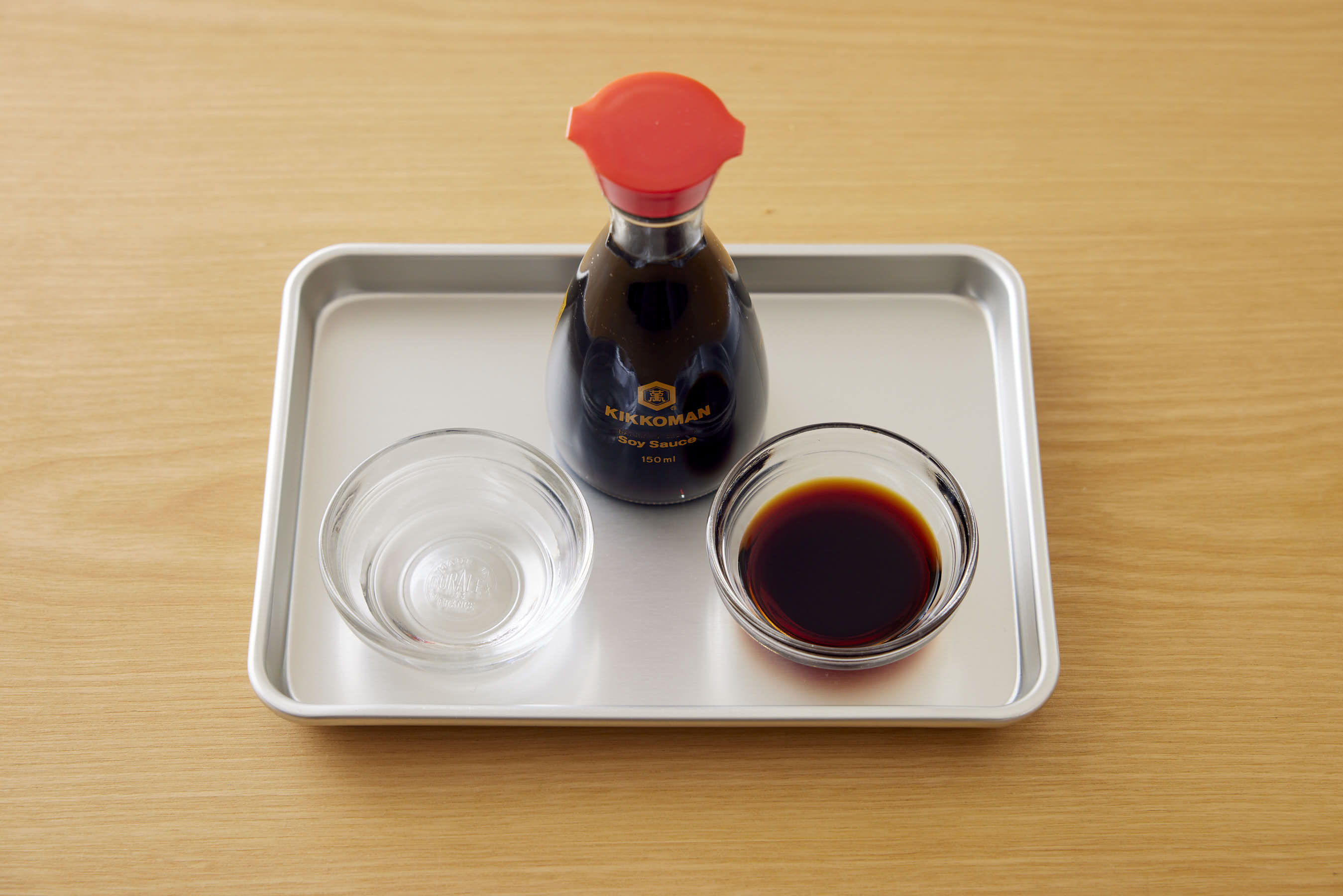 Soy sauce and water on a trey