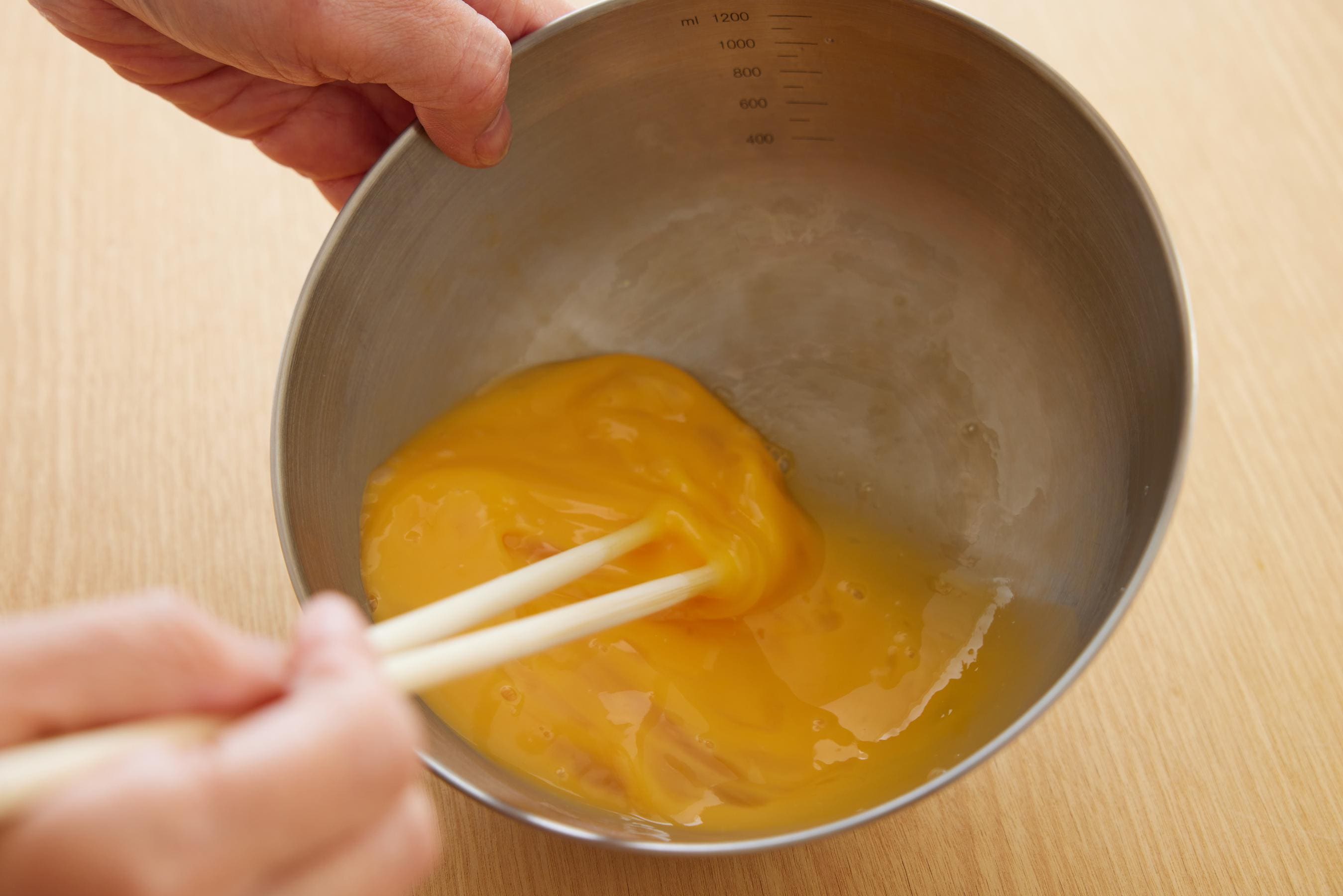 Beat the eggs in a bowl.