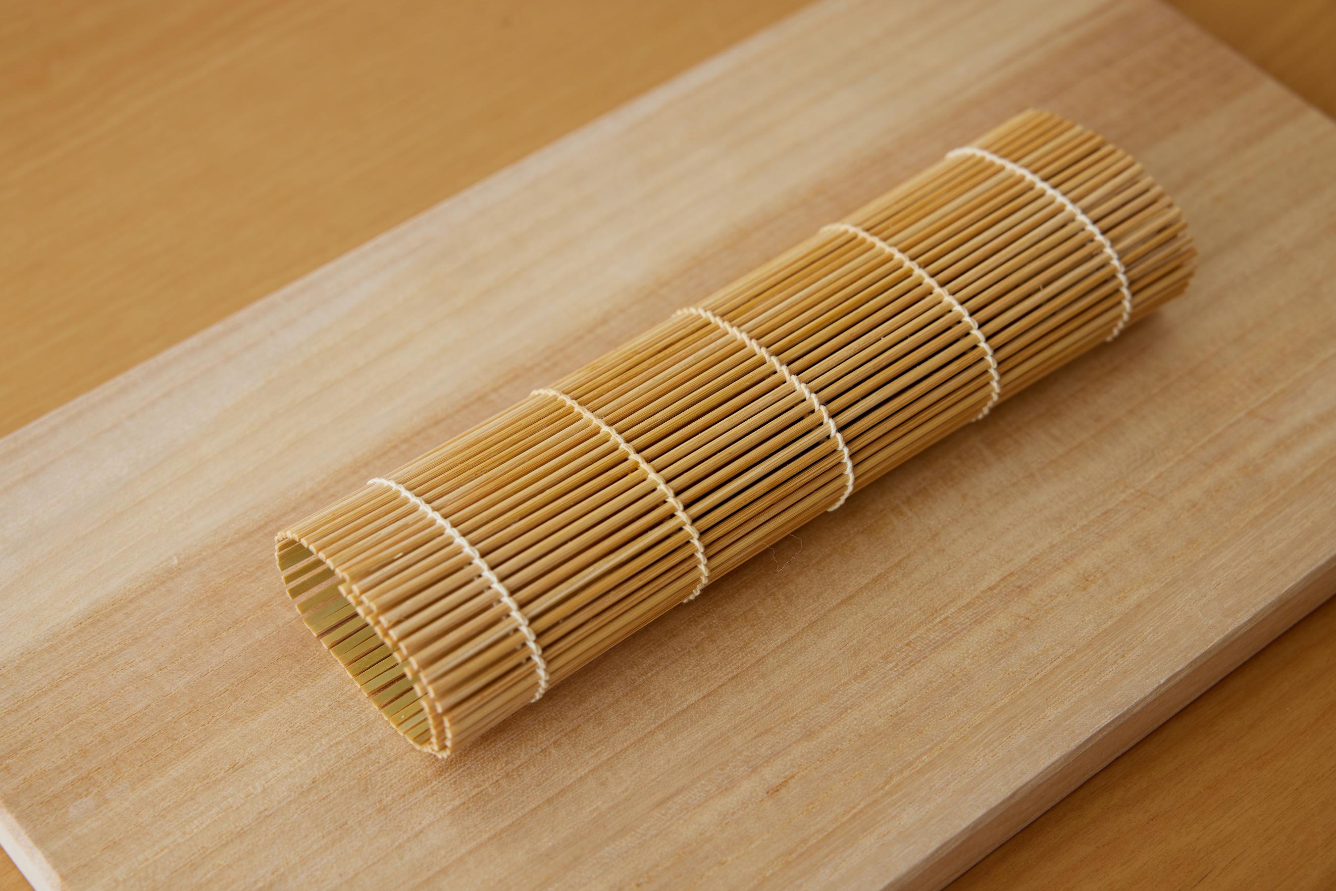 Shape the Tamagoyaki by rolling it in a makisu.