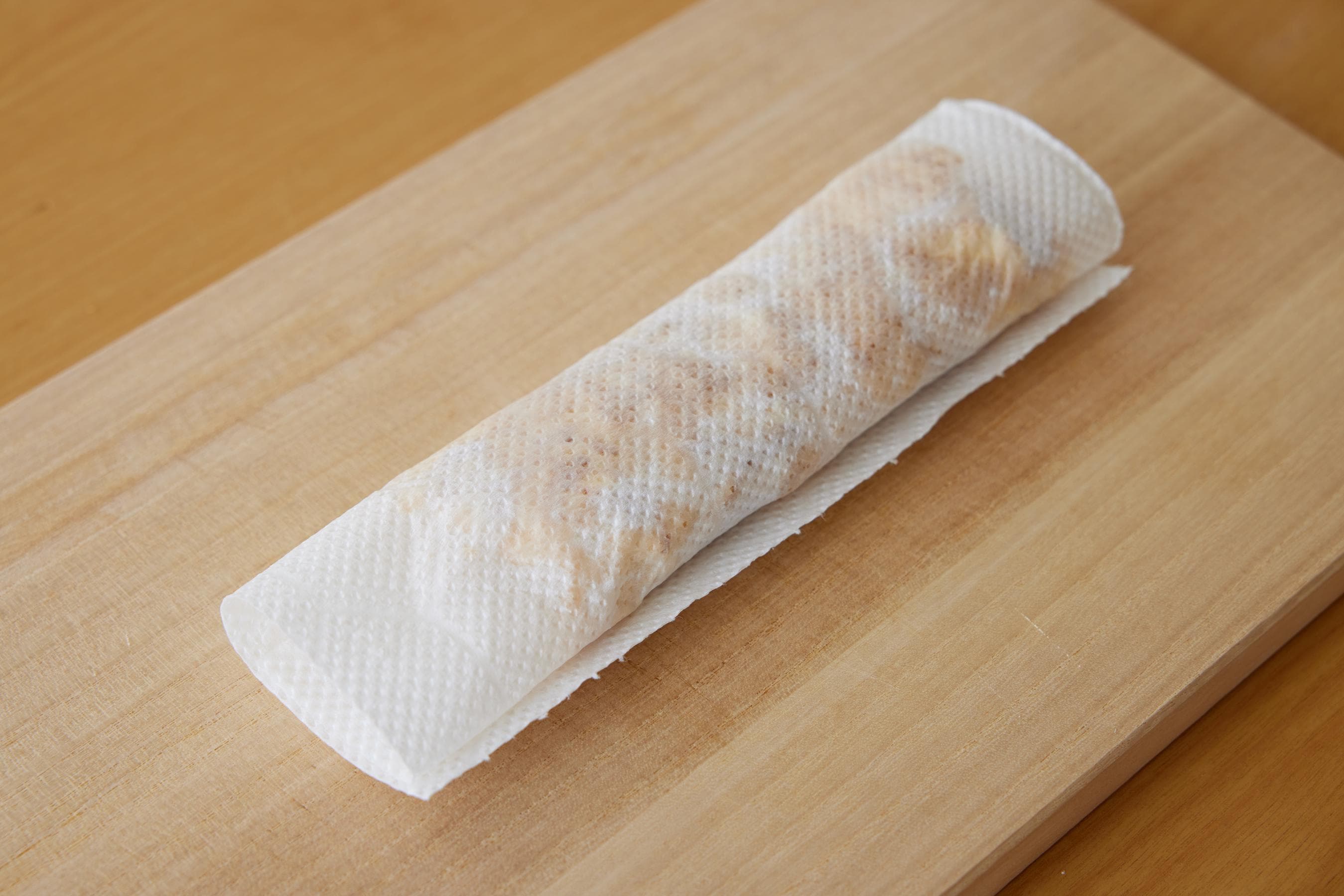 Roll the Tamagoyaki up inside the paper towel.