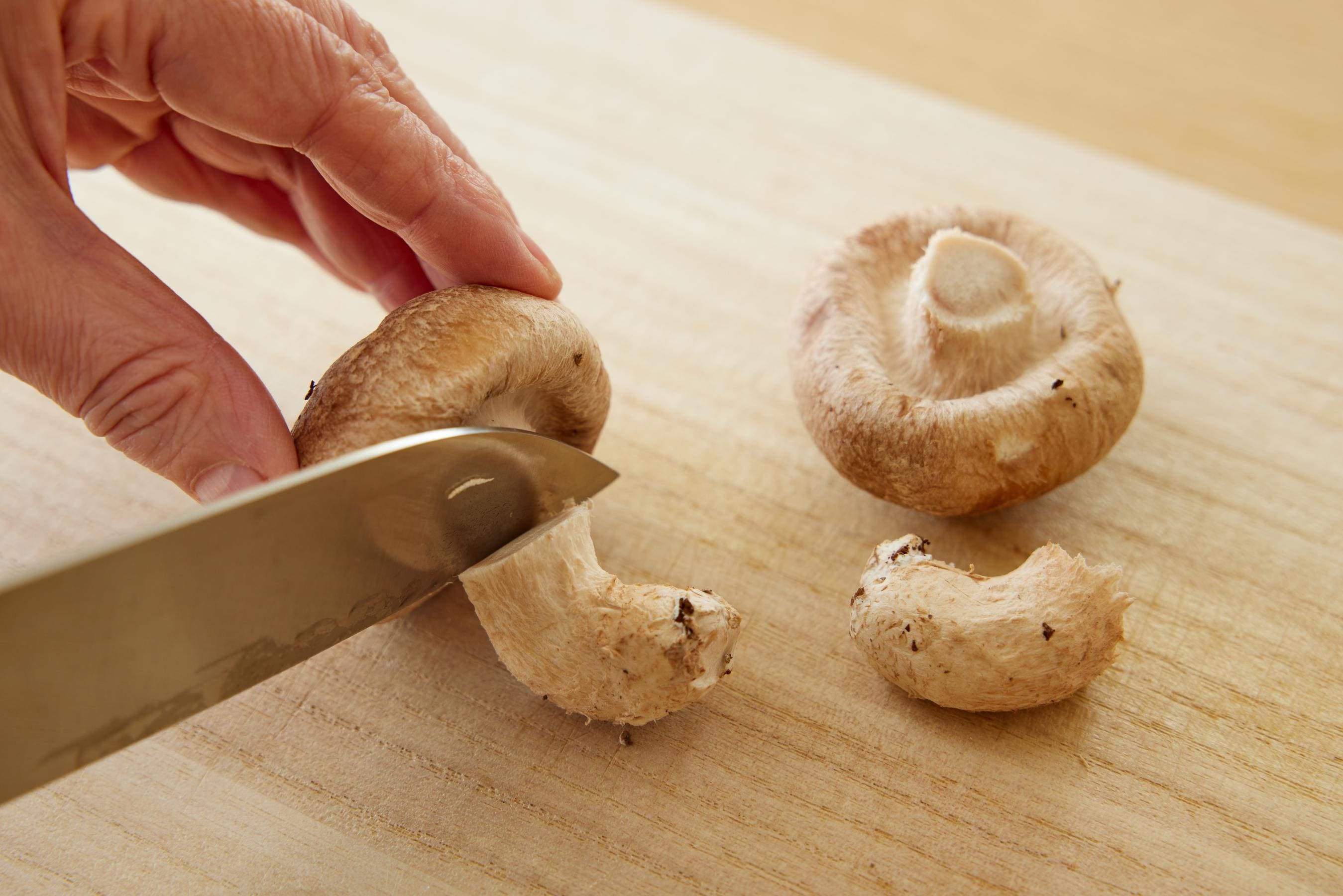 Preparing shiitake mushrooms.