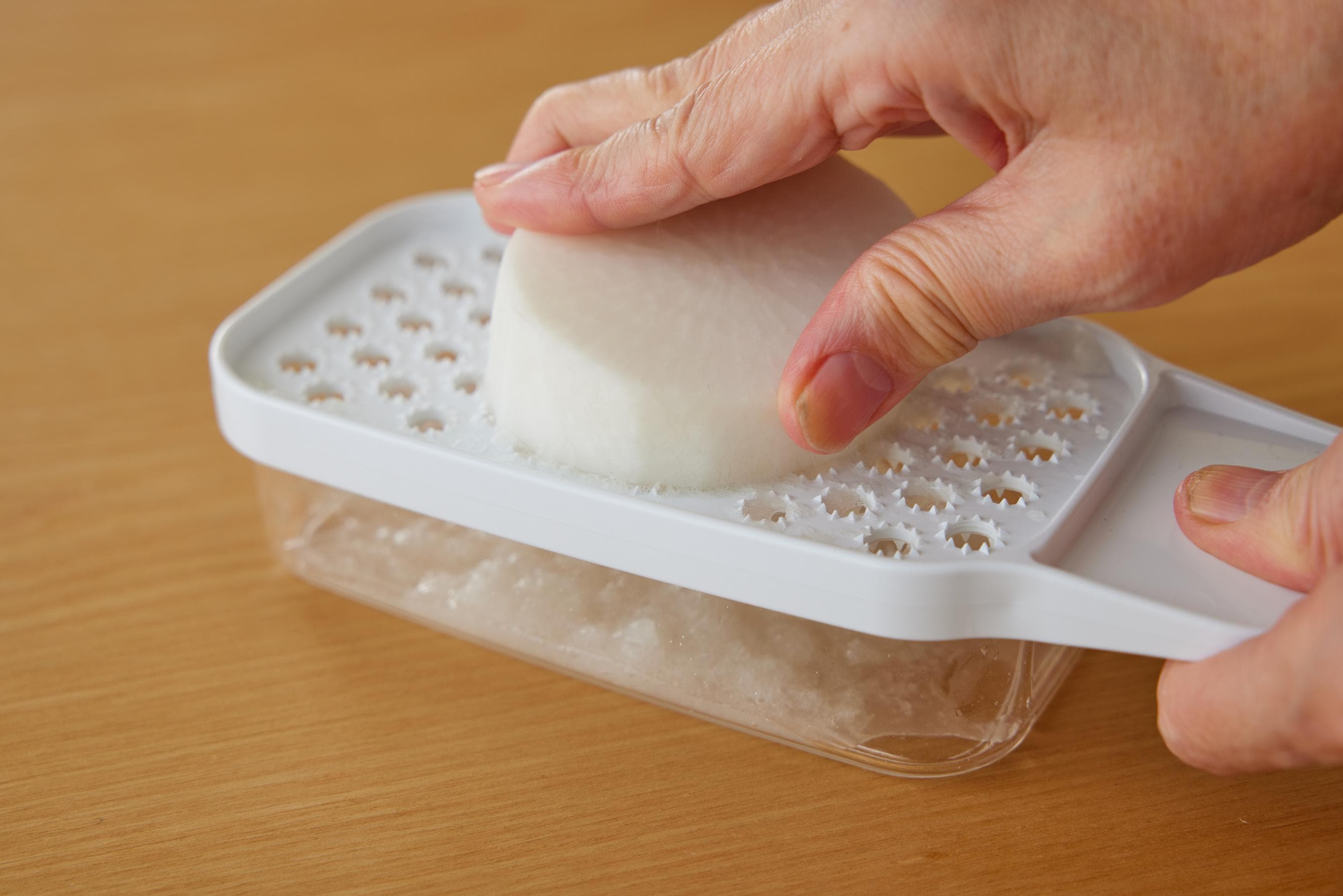 Grating the daikon radish.